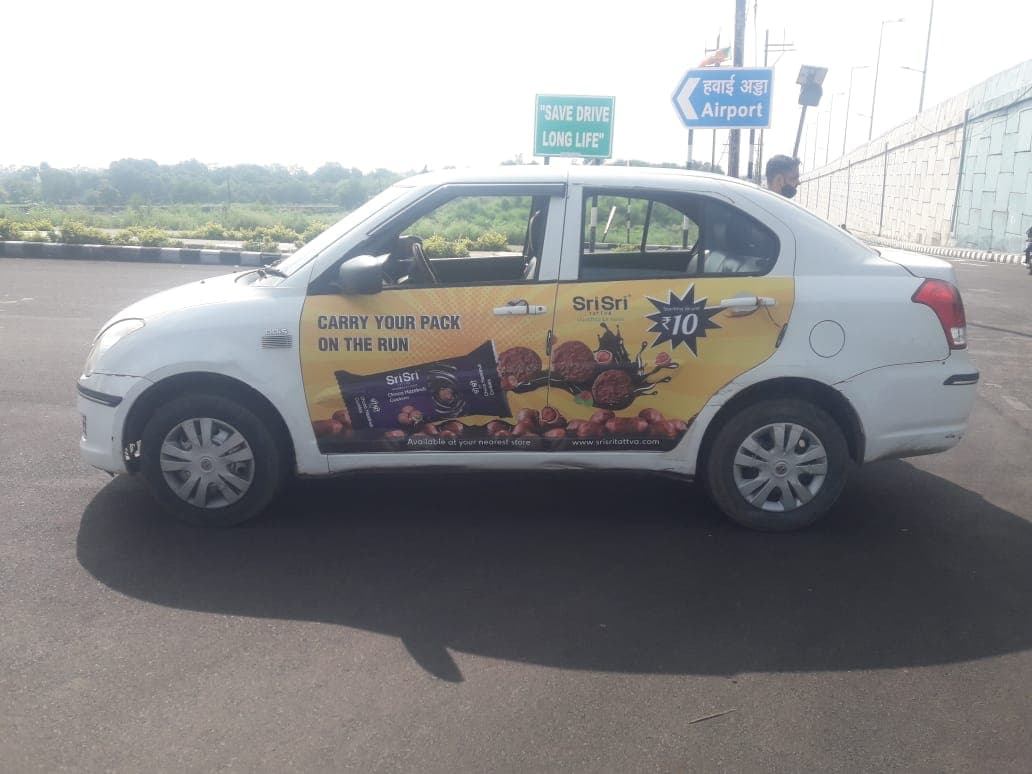 Cab Branding in Hyderabad - Cab branding full wrap example 1 - Sankalp Media Group